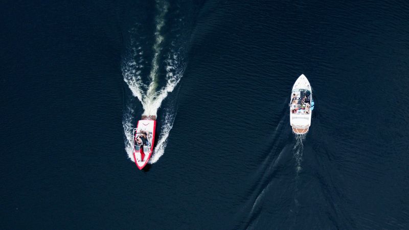 motorboat overtaken by sailboat
